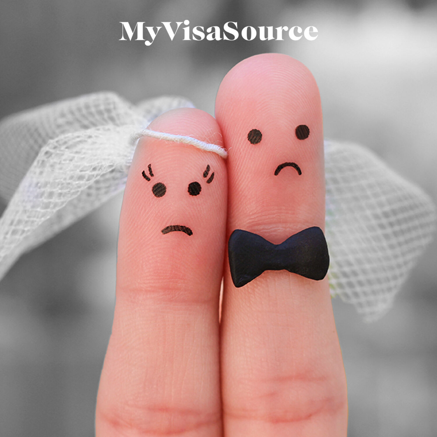 2 fingers dressed as married couple with unhappy faces drawn on my visa source