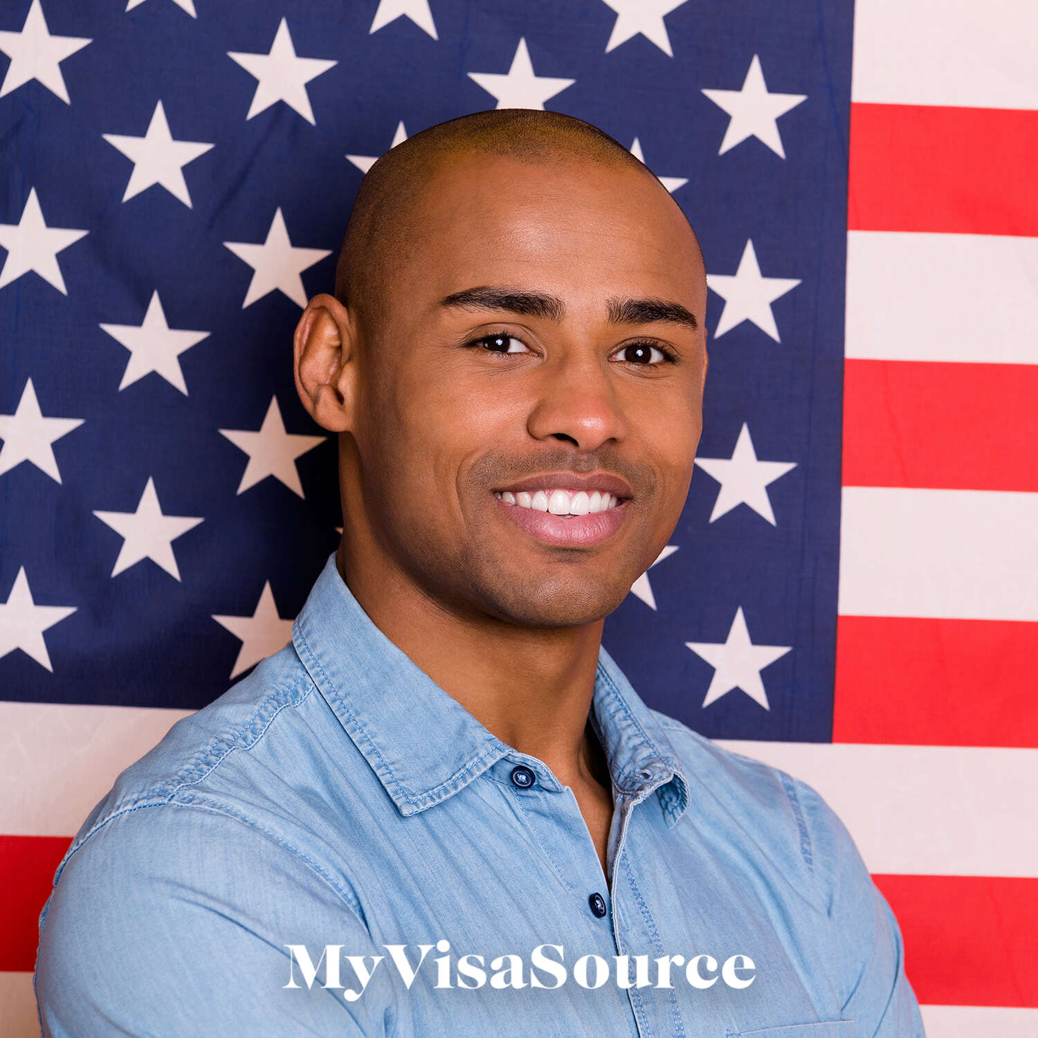 black man smiling standing in front of usa flag my visa source